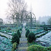 WINTER FROST COVERS THE SYMMETRICAL LINES OF PATHS  BEDS AND PLANTING IN THE POTAGER AT BARNSLEY HOUSE  GLOUCESTERSHIRE