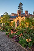 MORTON HALL GARDENS, WORCESTERSHIRE: KITCHEN GARDEN, BORDER, TULIP ANTOINETTE, AMAZING GRACE, DORDOGNE, BLACK HERO, IRIS MAUI MOONLIGHT, HEUCHERA AMETHYST MIST OR PLUM PUDDING