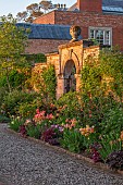 MORTON HALL GARDENS, WORCESTERSHIRE: KITCHEN GARDEN, BORDER, TULIP ANTOINETTE, AMAZING GRACE, DORDOGNE, BLACK HERO, IRIS MAUI MOONLIGHT, HEUCHERA AMETHYST MIST OR PLUM PUDDING
