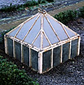 A VICTORIAN GLASS CLOCHE IN THE POTAGER AT BARNSLEY HOUSE  GLOUCESTERSHIRE