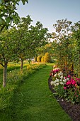 MORTON HALL GARDENS, WORCESTERSHIRE: MAY, SPRING, MEADOW, BORDER OF TULIPS, BULBS