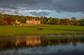 BOLESWORTH CASTLE, CHESHIRE, MAY, THE CASTLE SEEN FROM THE LAKE, SUNSET