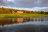 BOLESWORTH CASTLE, CHESHIRE, MAY, THE CASTLE SEEN FROM THE LAKE, SUNSET, BOAT