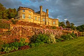 BOLESWORTH CASTLE, CHESHIRE, MAY, THE TERRACE BELOW THE CASTLE, STEPS, WISTERIA, CLEMATIS, SUNSET, LAWN