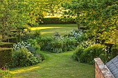 THE OLD VICARAGE, WORMLEIGHTON, WARWICKSHIRE: DESIGNER ANGEL COLLINS - BORDER, ALLIUM MOUNT EVEREST, SUNDIAL, LAWN, CLIPPED TOPIARY HEDGES, HEDGING