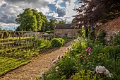 ASHBY MANOR HOUSE, NORTHAMPTONSHIRE: MAY, THE WALLED GARDEN, VEGETABLE GARDEN, PEONIES IN BORDER