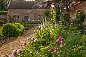 ASHBY MANOR HOUSE, NORTHAMPTONSHIRE: MAY, THE WALLED GARDEN, BORDER, PEONIES, DIGITALIS, FOXGLOVES