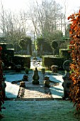 SYMMETRICAL LINES OF THE JUBILEE GARDEN IN FROST  WITH ARMILLARY SPHERE & BEECH HEDGES. SIR ROY STRONGS GARDEN