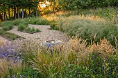 OLD PARK BARN, BUCKINGHAMSHIRE: GRASSES, MELICA CILIATA, SILKY- SPIKE MELIC, NEPETA HILL GROUNDS, WILDFLOWERS, GRAVEL GARDEN,  SCULPTURE, CONTAINER BY HANNAH BENNETT
