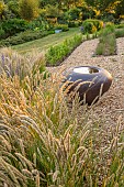OLD PARK BARN, BUCKINGHAMSHIRE: GRASSES, MELICA CILIATA, SILKY- SPIKE MELIC, NEPETA HILL GROUNDS, WILDFLOWERS, GRAVEL GARDEN,  SCULPTURE, CONTAINER BY HANNAH BENNETT