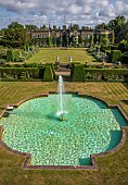 RENISHAW HALL & GARDENS, DERBYSHIRE: VIEW OF HALL FROM THE SWIMMING POOL, FOUNTAIN, YEW HEDGES, HEDGING, LAWN, JUNE