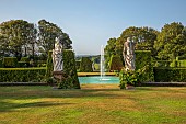 RENISHAW HALL & GARDENS, DERBYSHIRE: THE SWIMMING POOL, FOUNTAIN, YEW HEDGES, HEDGING, LAWN, STATUES, JUNE