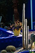 COURTYARD SURROUNDED BY CACTI  AND YELLOW TERRACOTTA POTS IN THE MOROCCAN STYLE YVES ST. LAURENT GARDEN DESIGNED BY MADISON COX. CHELSEA 97