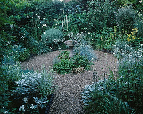 BIRDBATH_AND_GRAVEL_CIRCLE_AT_THE_CENTRE_OF_THE_SECLUDED_SILVER__WHITE_GARDEN_SWINTON_LANE__WORCS