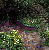 KEEYLA MEADOWS GARDEN SAN FRANCISCO. YELLOW TULIPS AND A COPPER MORNING GLORY ARCH.