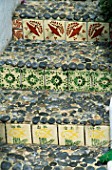 STEPS WITH DECORATIVE TILES AND PEBBLES