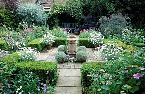 FORMAL_TOWN_GARDEN_MIXED_PLANTING_SURROUNDS_CENTRAL_SQUARE_OF_CLIPPED_BOX__BALLS_OF_SANTOLINA_AND_CH
