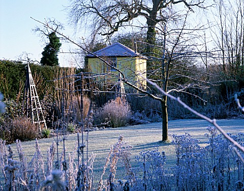 THE_SUMMERHOUSE_GARDEN_AT_ARROW_COTTAGE_IN_THE_FROST_BLUE_WOODEN_TRIPOD_IN_FOREGROUND_AND_THE_TOWER_