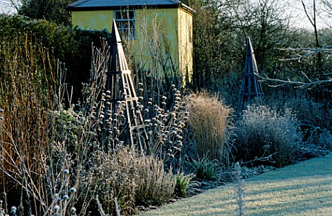 THE_SUMMERHOUSE_GARDEN_AT_ARROW_COTTAGE_IN_THE_FROST_BLUE_WOODEN_TRIPOD_IN_FOREGROUND_AND_THE_TOWER_