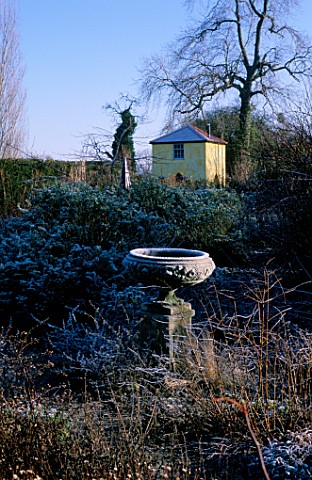 VIEW_OF_THE_TOWER_FROM_THE_ROSE_GARDEN_IN_THE_FOREGROUND_IS_A_LOVELY_STONE_URN_ARROW_COTTAGE__HEREFO