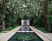 WATER FEATURE: TRANQUIL FORMAL RECTANGULAR  POOL WITH MARBLE CENTREPIECE SURROUNDED BY PHOENIX DACTYLIFERA AND CHAMAEROPS HUMILIS. GARDEN OF THE BOOK OF GOLD  CHELSEA 99