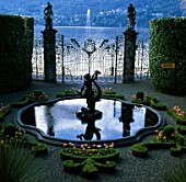 FOUNTAIN SURROUNDED BY BEDS FILLED WITH TULIP ORANGE FAVOURITE AT THE VILLA CARLOTTA  LAKE COMO  ITALY