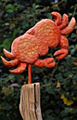 DETAIL FROM THE ASTROLOGICAL THRONE- A CARVED AND PAINTED WOODEN CRAB. ROBIN GREEN AND RALPH CADES SEASIDE STYLE GARDEN  LONDON.