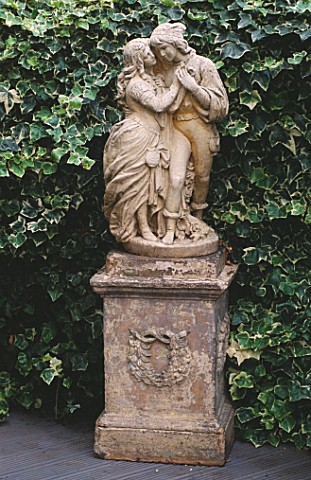 STATUE_BACKED_BY_IVY_ON_THE_DECK_OF_ANDREW_ANDERSON