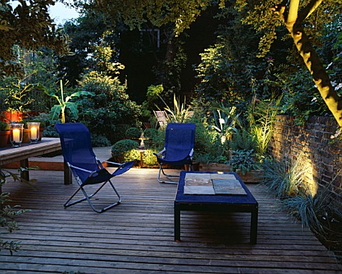 DECKED_TERRACE_WITH_LIGHTING_BLUE_DECK_CHAIRS__BLUE_TABLE__WOODEN_TABLE_WITH_CANDLES__BAMBOO_MUSA_BA