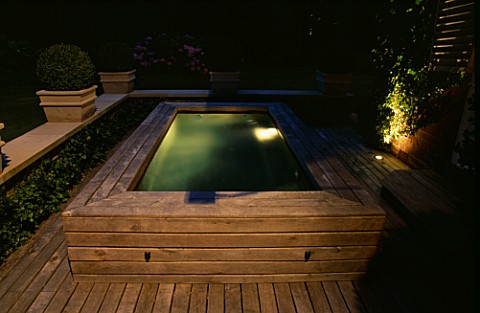 DECKED_TERRACE_WITH_HOTTUB_LIT_UP_AT_NIGHT