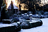 EASTLEACH HOUSE GARDEN  GLOUCESTERSHIRE  COVERED IN SNOW