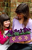 NANCY GIVES CLARE A PURPLE MOTHERS DAY BOX PAINTED WITH GOLD FLOWERS