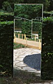 THE 10TH FESTIVAL INTERNATIONAL DES JARDINS  CHAUMONT-SUR-LOIRE  FRANCE  2001:BLACK GRAVEL  HEDGE AND MIRROR IN THE PAMPAS GARDEN BY MARTINA BARZI AND JOSEFINA CASARES