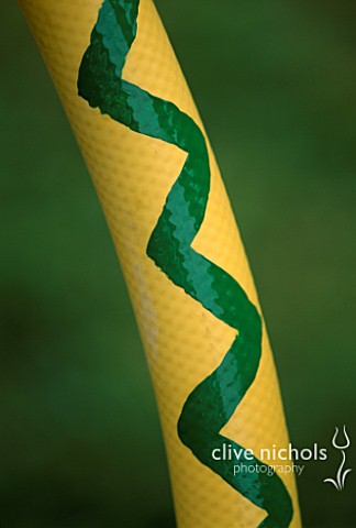 WATER_FEATURE_DETAIL_OF_WATER_SERPENT_MADE_FROM_YELLOW_HOSE_DESIGNER_CLARE_MATTHEWS
