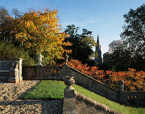 VIEW_TOWARDS_THE_CHURCH_FROM_THE_STEPS_AT_ENGLEFIELD_HOUSE__BERKSHIRE__WITH_RHUS_TYPHINA_AND_STONE_B