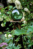 GREEN GLASS GAZING BALL IN BORDER/CHELSEA 2002/OLIVER MCNEIL