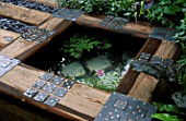 SMALL POND EDGED WITH WOOD BY DAVID ROSEWARNE AND MAGIE GRAY/CHELSEA 2002