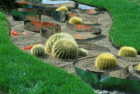 GRAVEL__ORANGE_PLASTIC__METAL_STRIPS_AND_ECHINOCACTUS_IN_THE_HAPPENING_GARDEN_BY_TONY_HEYWOOD_AT_THE