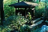 THE INDONESIAN GAZEBO AND KOI POND IN THE WOODLAND. DESIGNERS: ILGA JANSONS AND MIKE DRYFOOS