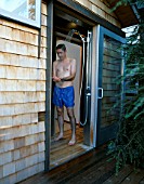 STEFANO USING THE OUTDOOR SHOWER INSIDE: DESIGNED BY BOB SWAIN  SEATTLE  USA