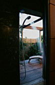 THE OUTDOOR SHOWER SEEN FROM INSIDE THE HOUSE: DESIGNED BY BOB SWAIN  SEATTLE  USA