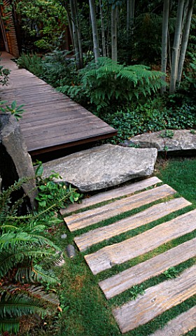 VIEW_ALONG_FRONT_WOODEN_PATH_WITH_LAWN___ROCKS__DECKING_AND_ASPENS_DESIGNER_BOB_SWAIN__SEATTLE__USA