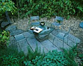 SEATING AREA WITH BAMBOOS  METAL CHAIRS AND GLASS TABLE: DESIGNER BOB SWAIN  SEATTLE  USA