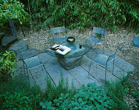 SEATING_AREA_WITH_BAMBOOS__METAL_CHAIRS_AND_GLASS_TABLE_DESIGNER_BOB_SWAIN__SEATTLE__USA