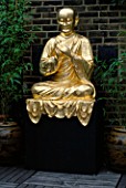 GOLD BUDDHA IN A ROOF GARDEN DESIGNED BY CLAIRE MEE