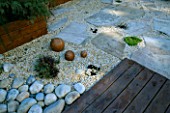 ROOF GARDEN WITH BAMBOO FENCING   WHITE BOULDERS  FOSSIL MINT SLABS  WOODEN BALLS AND RED CEDAR DECKING: DESIGN BY ALISON WEAR ASSOCIATES