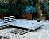 ROOF GARDEN: BARLEYCORN GRAVEL AND BAMBOO CHAIRS: DESIGN BY ALISON WEAR ASSOCIATES