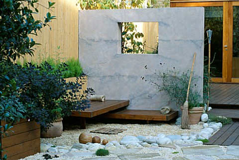 ROOF_GARDEN_BAMBOO_FENCE__WHITE_BOULDERS__RED_CEDAR_DECK_AND_SEATS__RENDERED_WALL_WITH_WINDOW_AND_BE