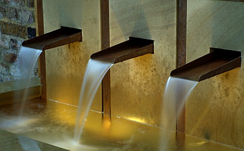 WATER_FEATURE_LIT_UP_AT_NIGHT_RAISED_WATER_FEATURE_WITH_COPPER_SPOUTS_DESIGNER_CLAIRE_MEE