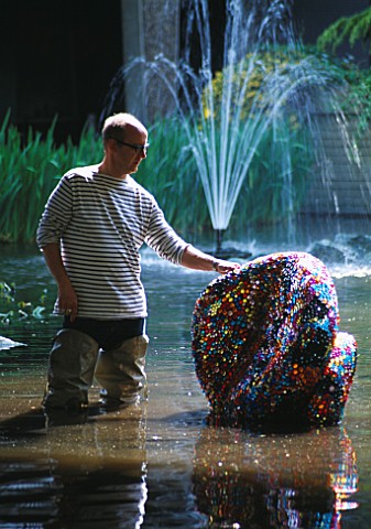 DESIGNER_TONY_HEYWOOD_TONY_HEWYWOOD_IN_WATER_WITH_A_SCULPTURE_CALLED_ARE_ALL_THINGS_BRIGHT_AND_BEAUT